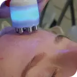 Skincare device on forehead