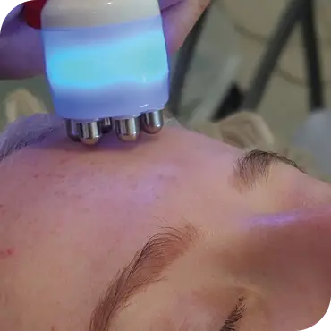 Skincare device on forehead